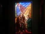 Stained glass Padre hearing confession